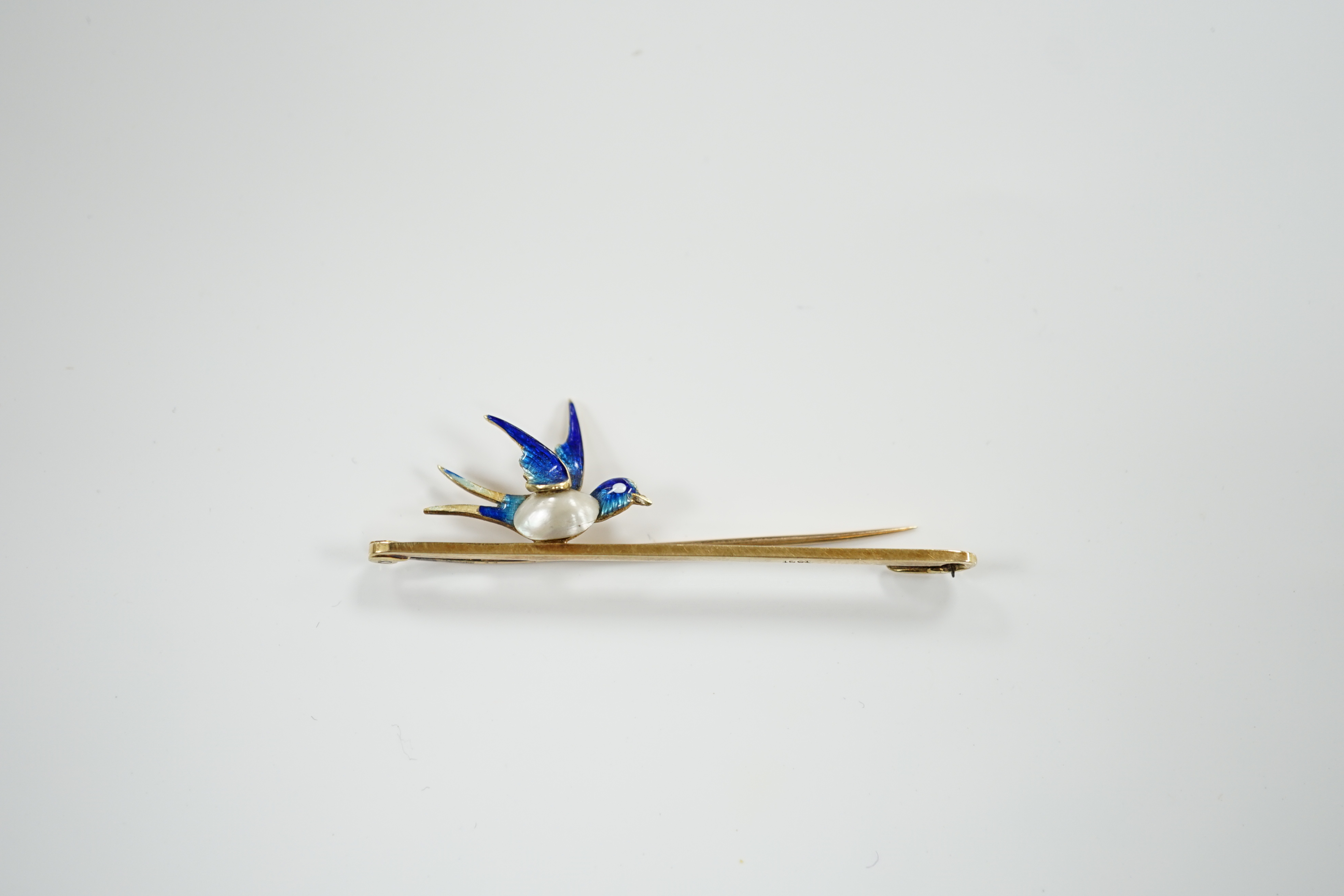 A yellow metal, baroque pearl and enamel bluebird bar brooch, 48mm, gross weight 3.1 grams.